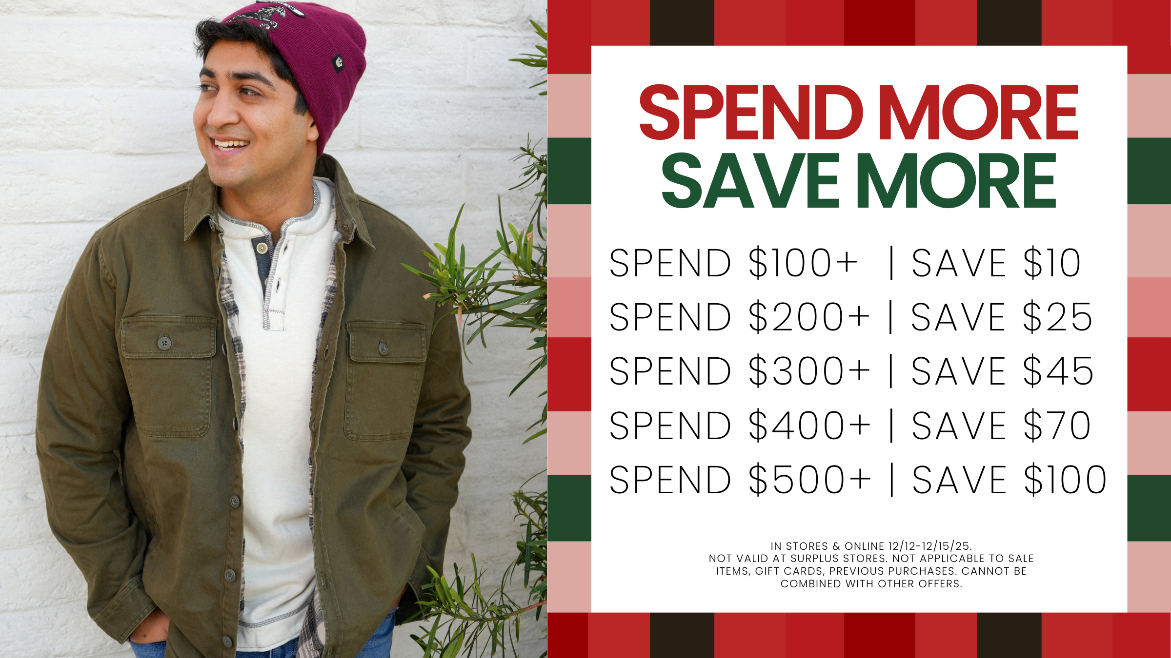 A man wearing a green jacket and red beanie stands against a white brick wall with a promotional graphic next to him. 