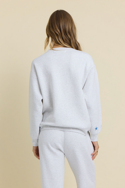 Ash grey embroidered crewneck sweatshirt and sweatpants, back view with star logo
